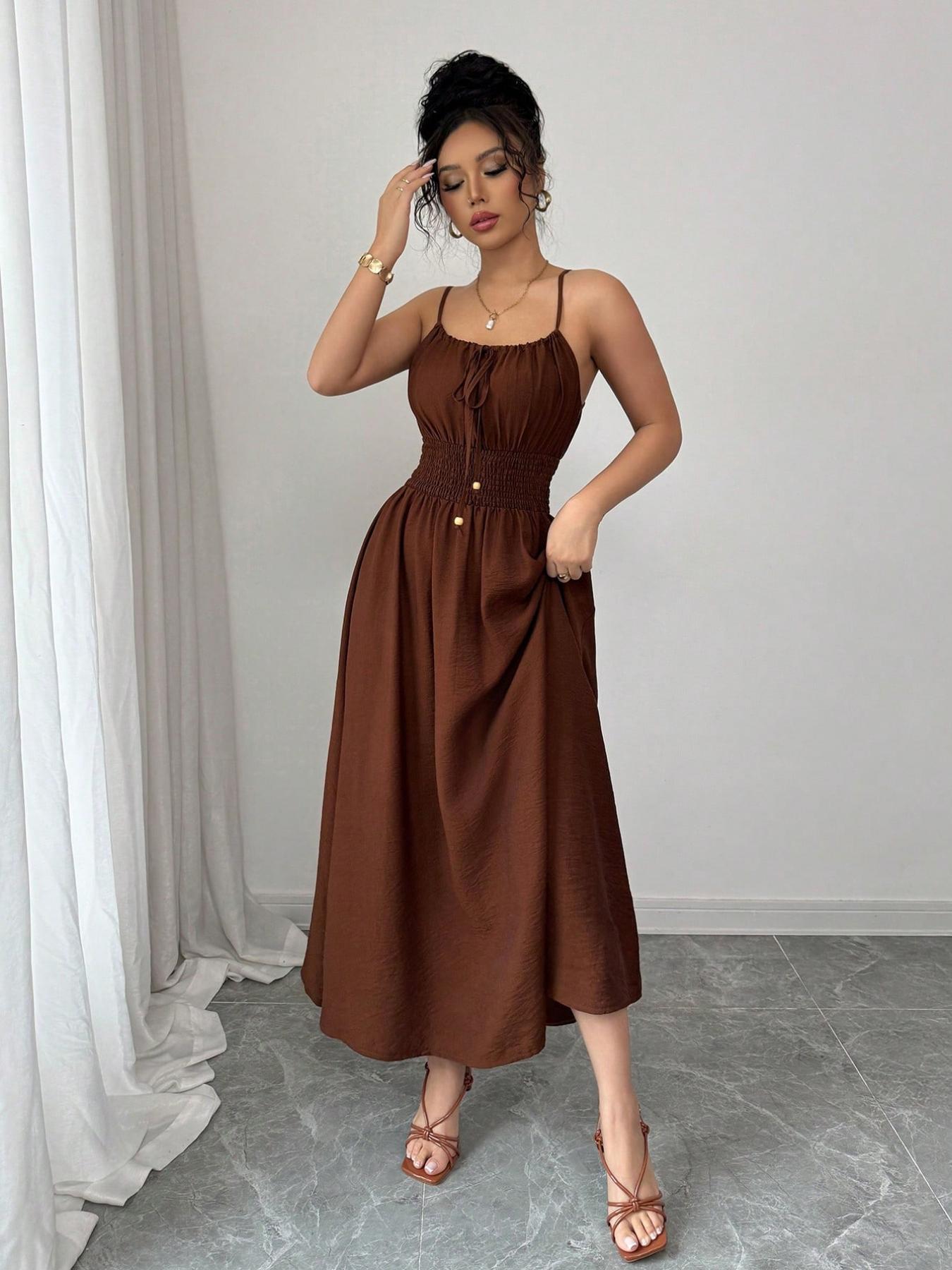 A women's fashionable and high-end French gentle style waist cinching spaghetti strap camisole dress with lace up bead design, suitable for summer, beach wear, dates, dinners, and travel Straps Summer Dress