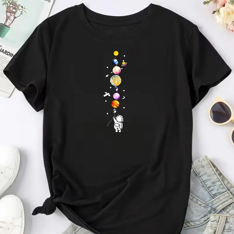 Pure cotton T-shirt featuring vibrant astronaut and planet patterns.