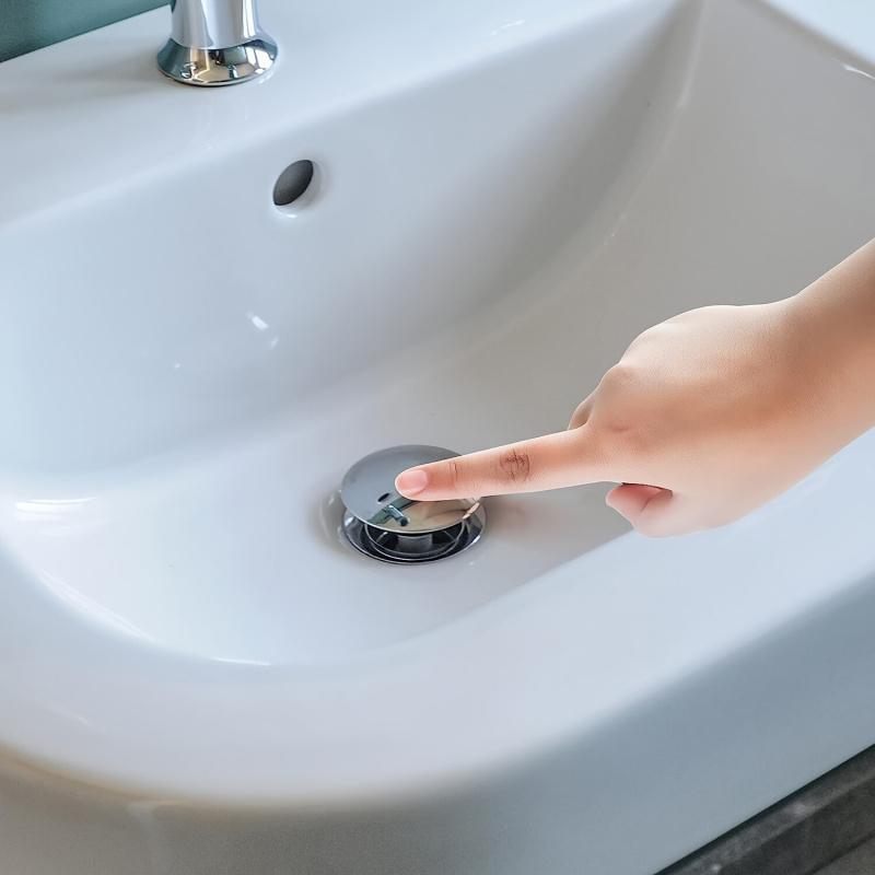 Universal sink plug, using a spring-type drain plug