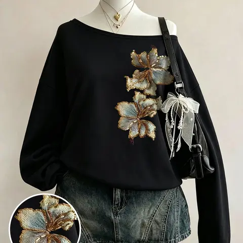 Autumn women's off-shoulder black sweatshirt with luxurious gold floral embroidery, loose and comfortable fit, stylish dark rock & Korean street style, perfect for daily gatherings, dates, commuting, and home wear #OffShoulderTop #FloralEmbroidery #OOTD