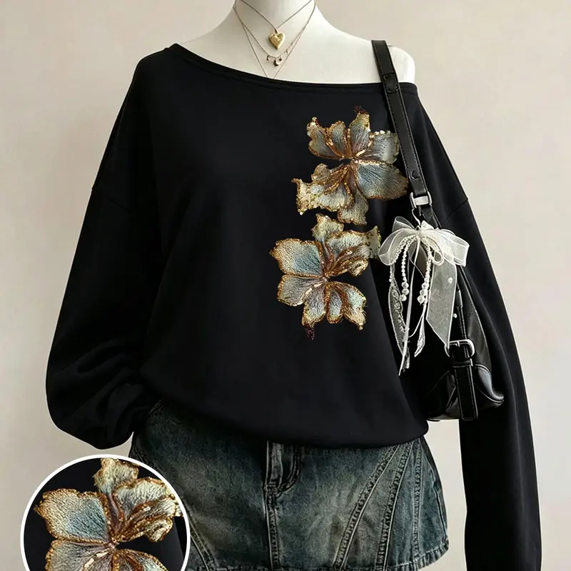 Autumn women's off-shoulder black sweatshirt with luxurious gold floral embroidery, loose and comfortable fit, stylish dark rock & Korean street style, perfect for daily gatherings, dates, commuting, and home wear #OffShoulderTop #FloralEmbroidery #OOTD