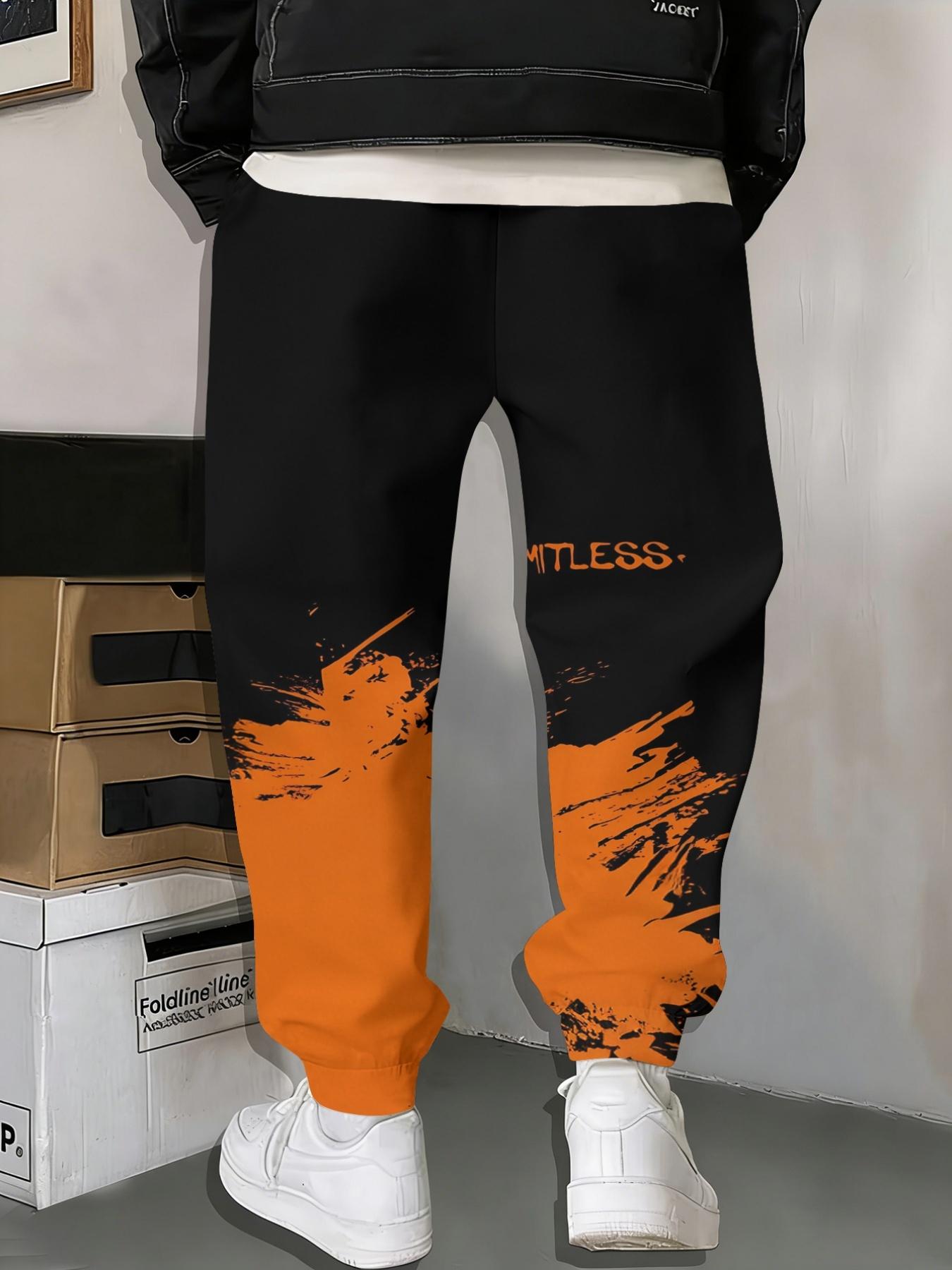 Stylish Men's Printed Track Pants with Gradient Orange Print, Drawstring and Pockets. Comfortable and Casual, Made of Stretch Polyester.