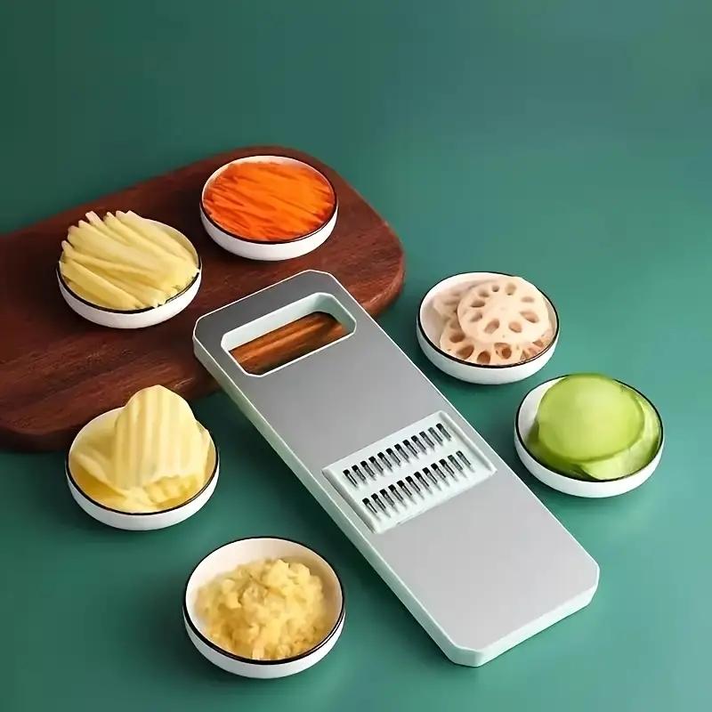 Multifunctional kitchen vegetable cutter. Its design meets the needs of shredding, slicing, grating, etc. It is made of healthy materials, with sharp cutting edges, and is easy to operate and clean.