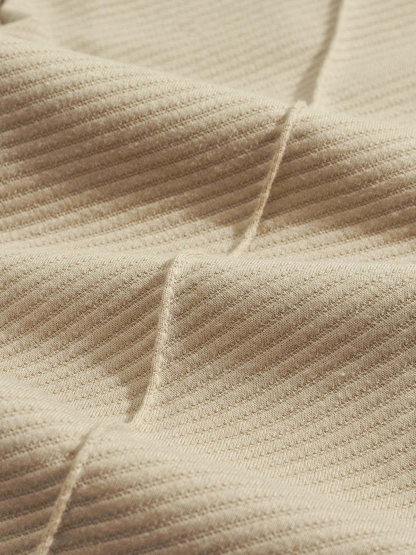 Men's two-piece casual suit outfit with a stand-up collar, long sleeves with a subtle texture, and long pants. The top has a single- button front with a pocket, suitable for daily outings, casual commuting, and light business casual occasions. Men's suit.