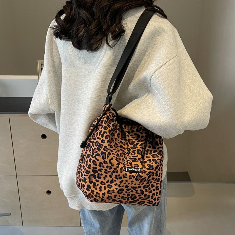 Women's Leopard Print Drawstring Bucket Bag, Lightweight Nylon Crossbody Shoulder Purse, Adjustable Strap, Casual All-Season Handbag