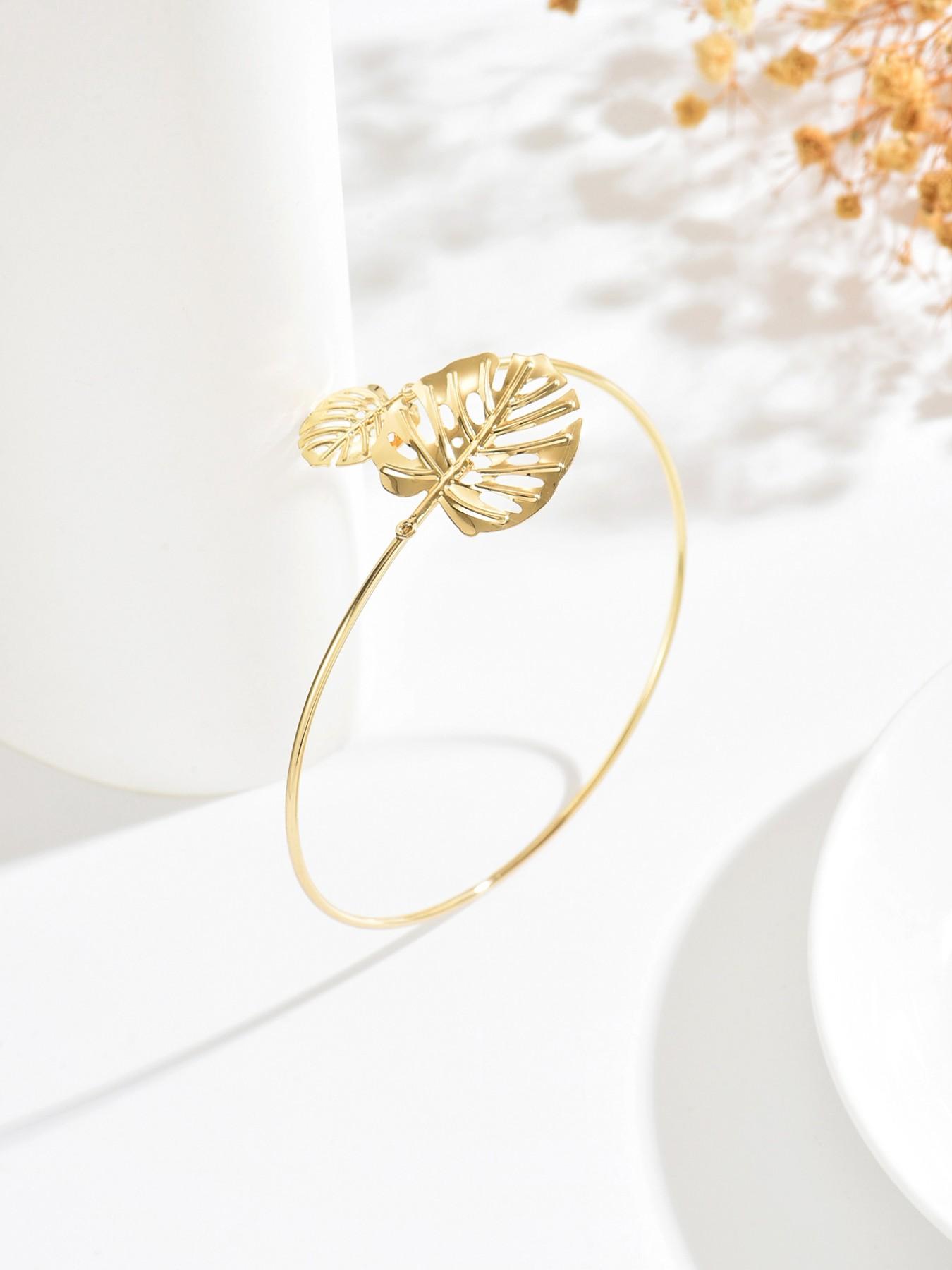 A bohemian-style, fashionable, vacation-inspired, delicately carved leaf-shaped adjustable bracelet/armband. A perfect gift for your loved one, mother, or best friend. Ideal for Valentine's Day, Mother's Day, Women's Day, or Thanksgiving.