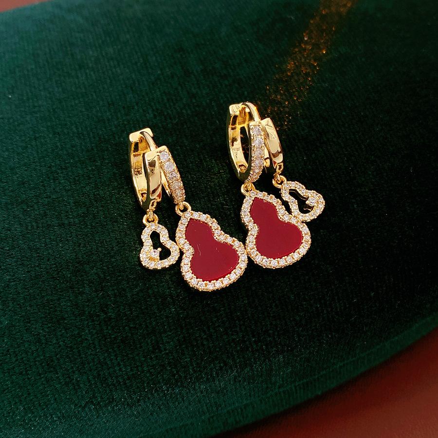 A pair of zirconia drop earrings featuring openwork ear hooks with real gold plating in an elegant, light-luxury Oriental style exquisite, versatile New Chinese-style earrings