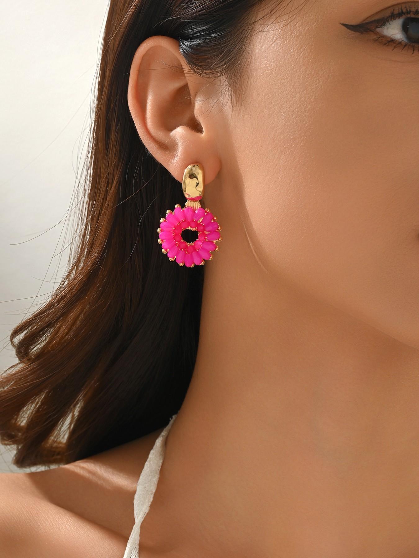 A pair of handcrafted, beaded dangle earrings featuring a chic Bohemian resort style. These round earrings exude an elegant, refined, and understated aesthetic with a premium feel, available in a variety of colors. for women to wear on any occasio