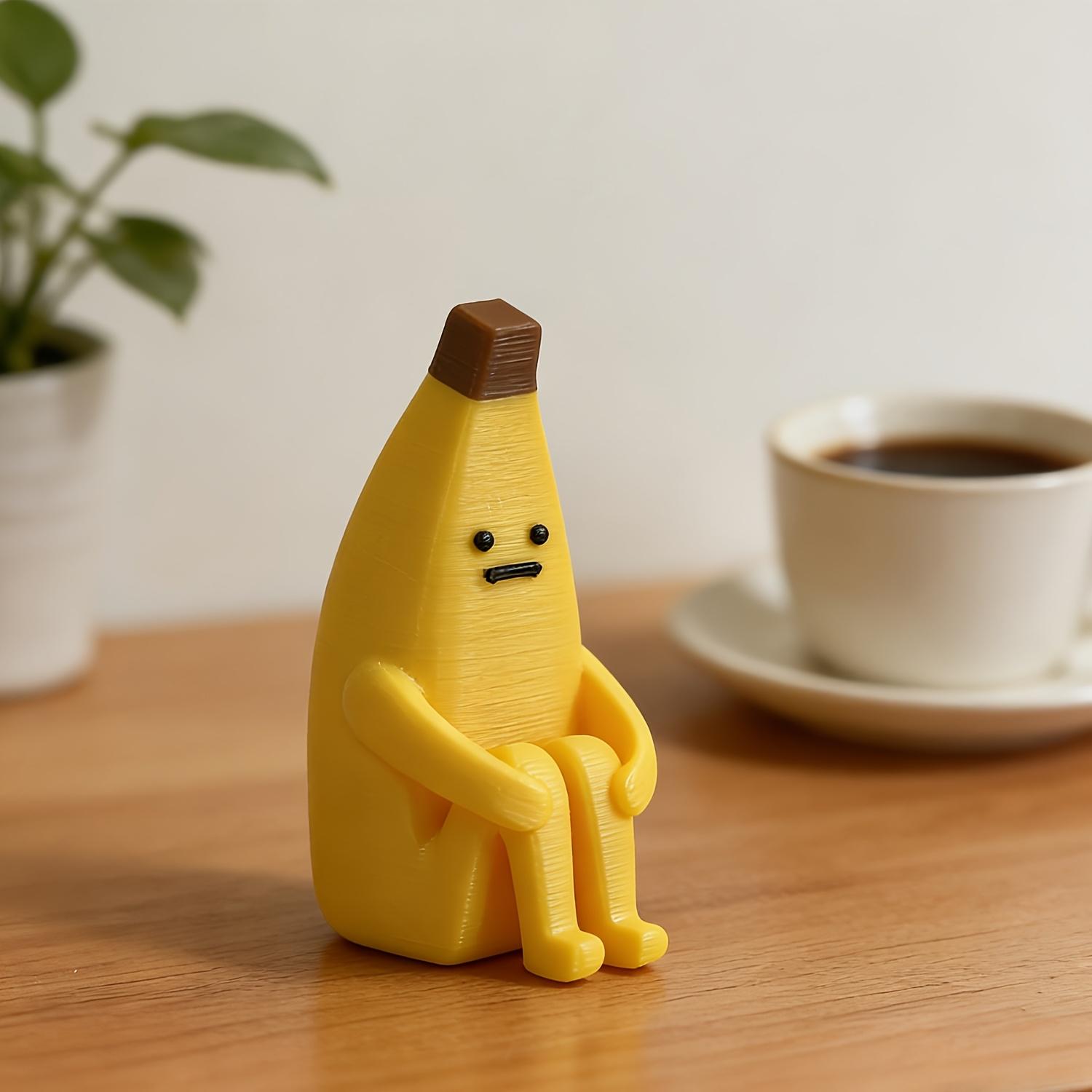 A 3D-printed "Anxious Banana" ornament, crafted from durable plastic—perfect for use as a home tabletop display, office decor, or a unique decorative accent.