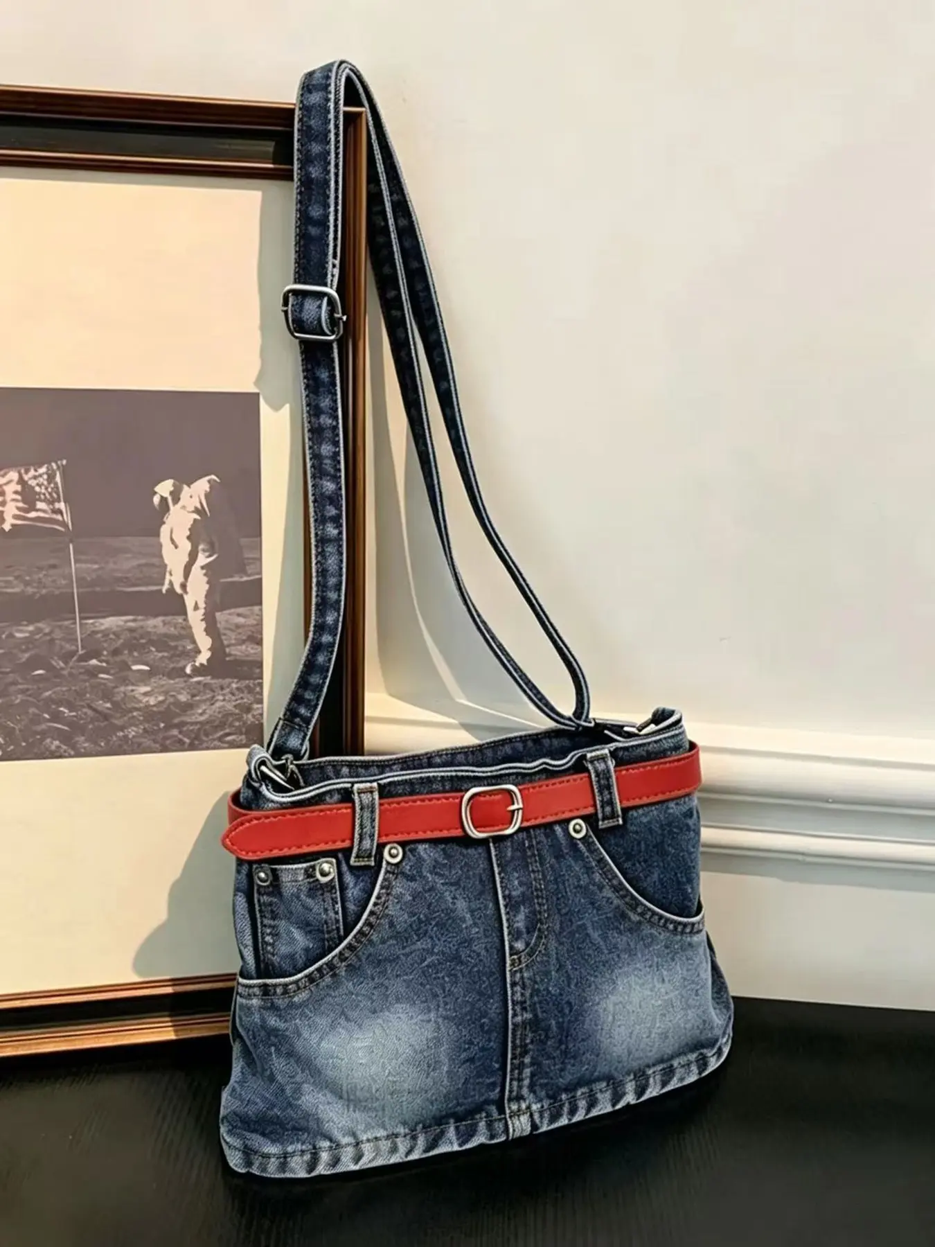 Niche design fashion vintage denim mini skirt style crossbody bag, available in two colors with a red belt design for a unique look, adjustable shoulder strap, perfect for daily commuting, travel, going out, and taking photos; a versatile shoulder bag.