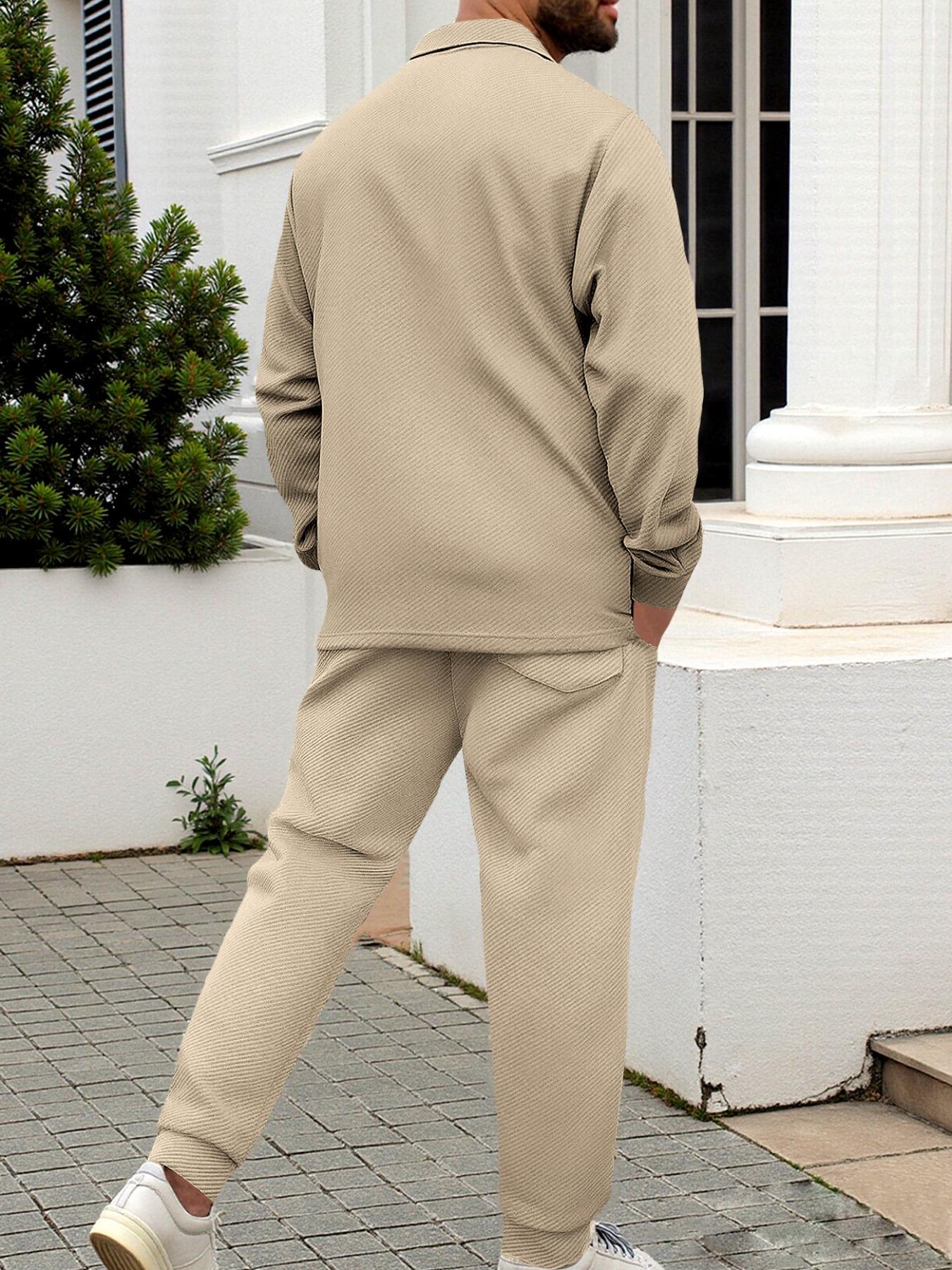 Men's two-piece casual suit outfit with a stand-up collar, long sleeves with a subtle texture, and long pants. The top has a single- button front with a pocket, suitable for daily outings, casual commuting, and light business casual occasions. Men's suit.