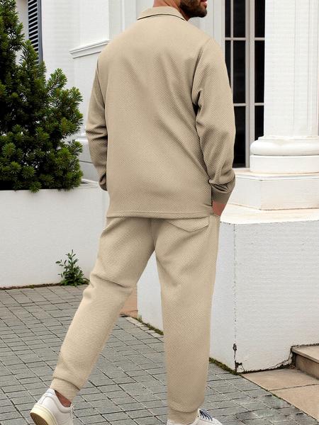 Men's two-piece casual suit with a stand-up collar, long sleeves with a subtle texture, and long pants. The top has a single- button front with a pocket, suitable for daily outings, casual commuting, and light business casual occasions. Men's suit.