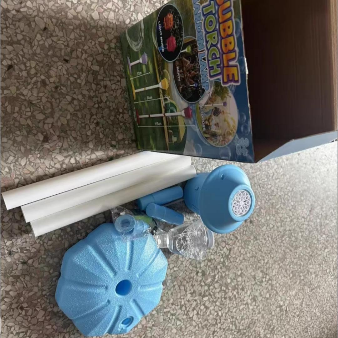 Streetlight Bubble Machine, “Torch” Bubble Machine with Music and Lights—an outdoor children's toy perfect for weddings and parties. Suitable for various occasions. Requires 3 AA batteries (not included). Recommended for ages 3 and up. Comes in a box.