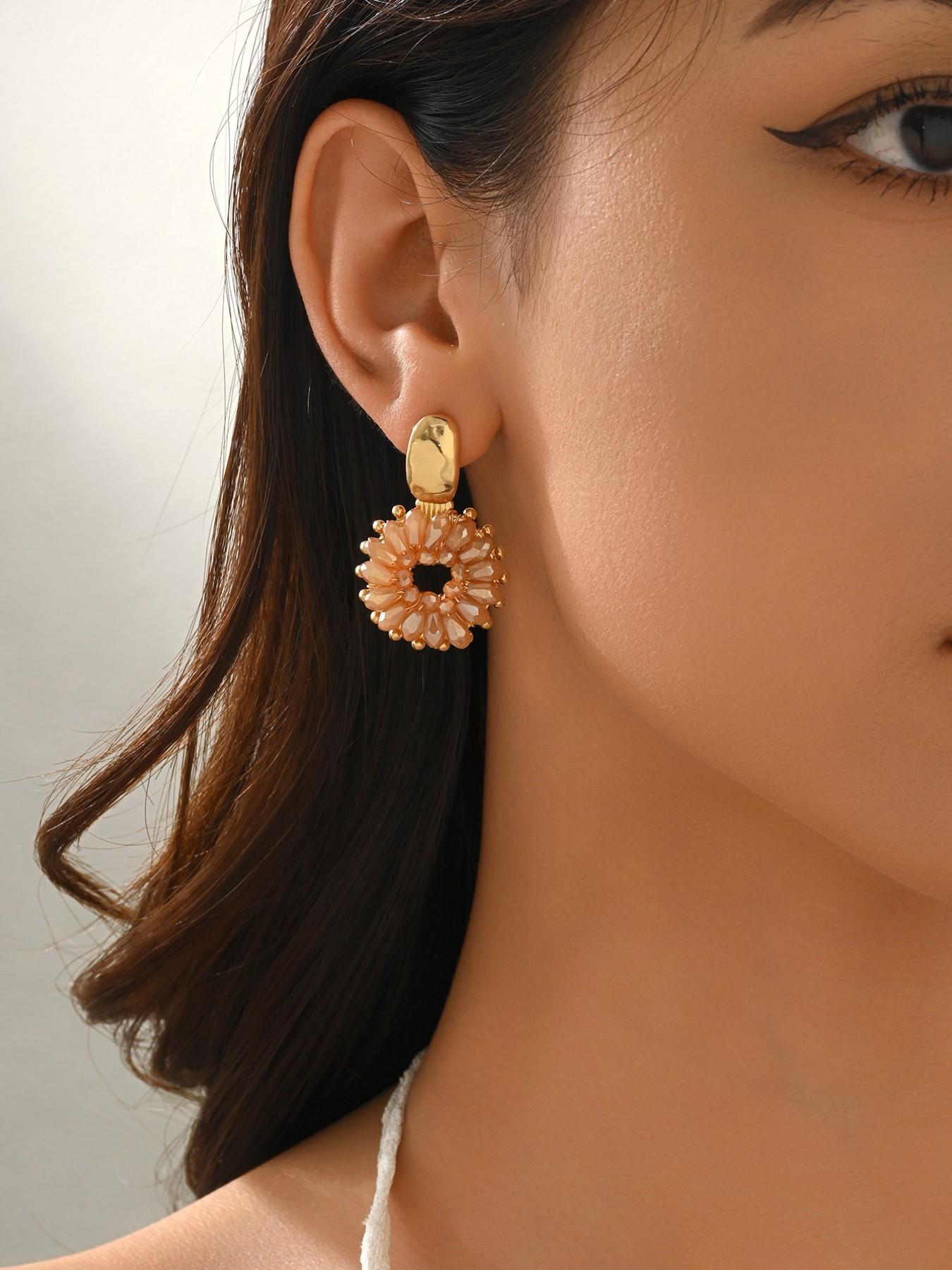 A pair of handcrafted, beaded dangle earrings featuring a chic Bohemian resort style. These round earrings exude an elegant, refined, and understated aesthetic with a premium feel, available in a variety of colors. for women to wear on any occasio