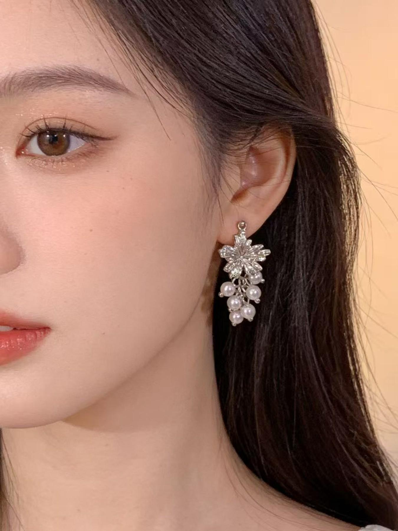 Exquisite metallic maple leaf shape with layered pearl tassels, creating a gentle and romantic vibe. The dangle design sways elegantly, adding a touch of sophistication to your daily look.