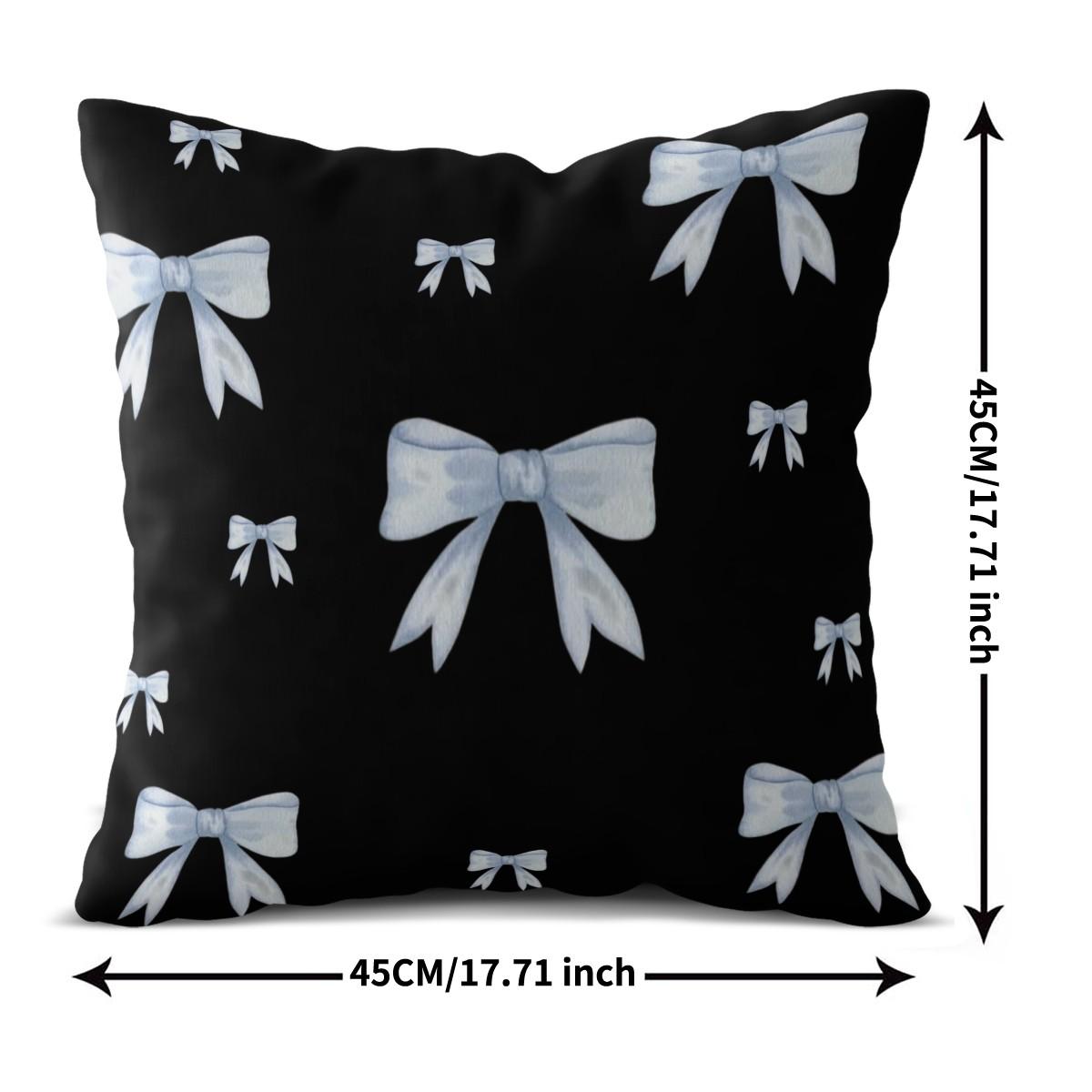 Soft short plush throw pillow with black background and blue bowknot print pattern, featuring a variety of patterns, soft and skin-friendly, a comfortable good for home or travel, embodying a lazy home style