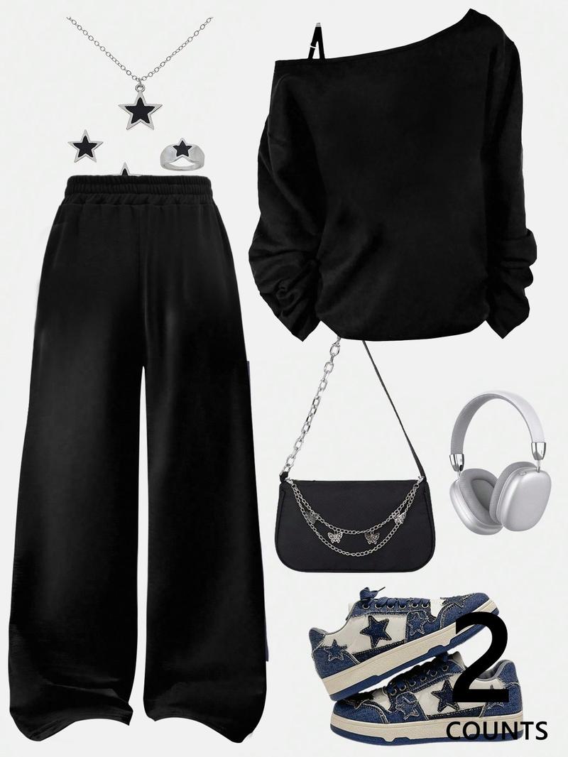 A teenage girl's off-shoulder top and wide-leg casual trousers; a loose-fitting, oversized casual long-sleeved top with a letter print paired with loose-fitting drawstring trousers; soft, suitable for women, and versatile.