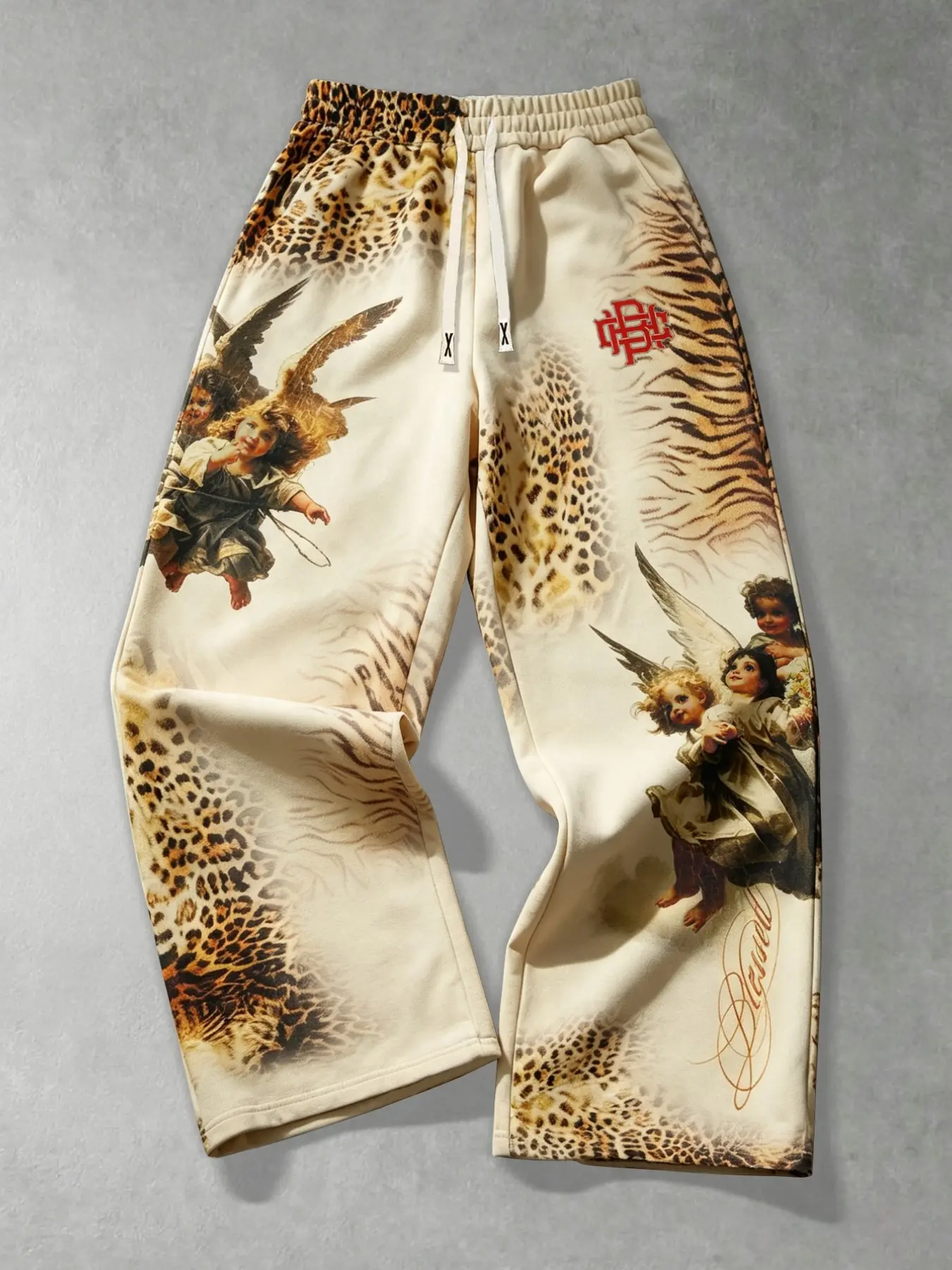 Men's wide-leg sweatpants featuring a retro American-style oil painting, angel motif, and leopard print patchwork; designed with an elastic drawstring waist and a loose, straight-leg fit—a versatile, high-street hip-hop style suitable for couples.