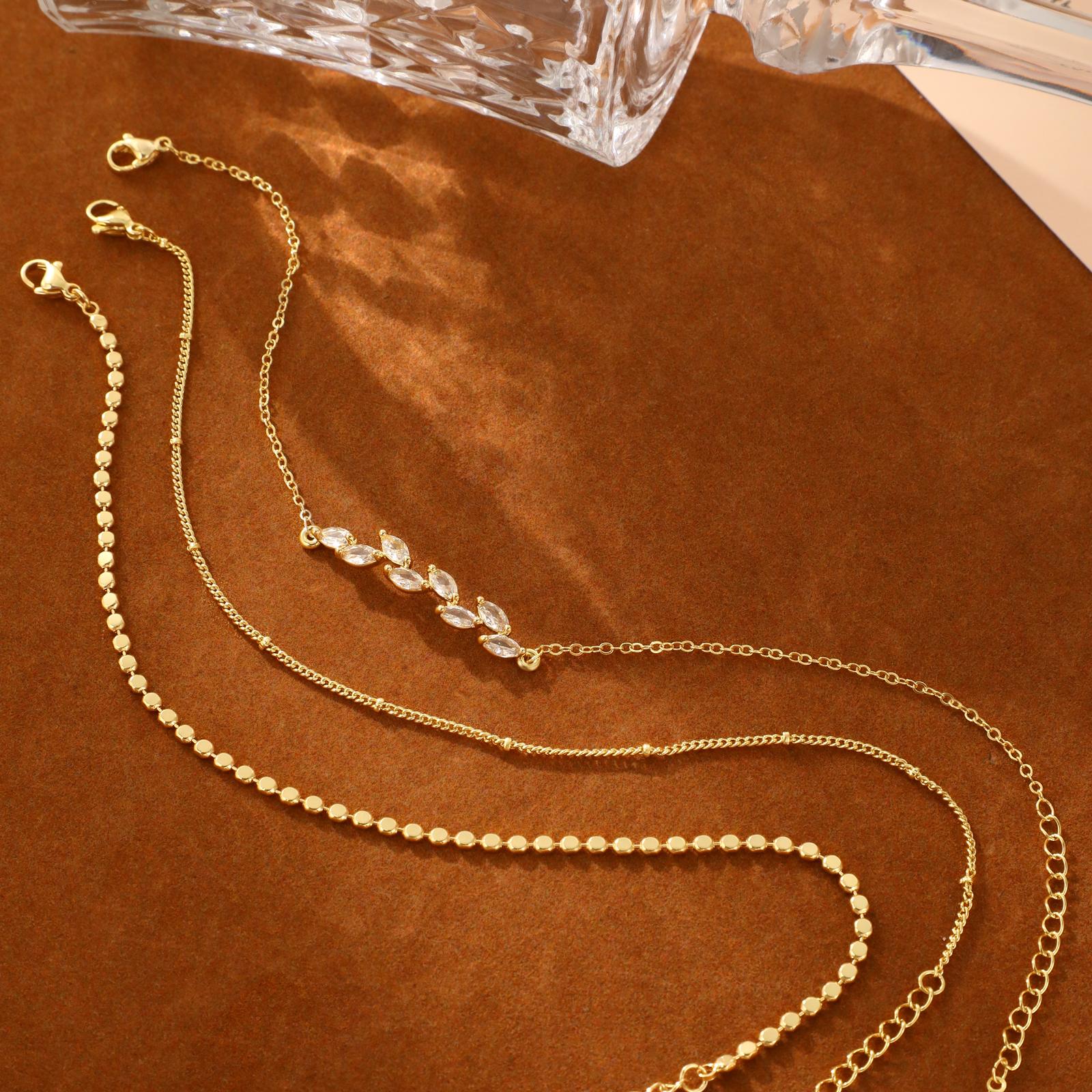 TASISO 14k Gold Plated Layered Anklet Set Waterproof Herringbone Paperclip Beaded Figaro Cuban Chain 4 Pieces Womens Gold Ankle Bracelet Beach Stackable Anklet Bracelet Jewelry Gifts for Women