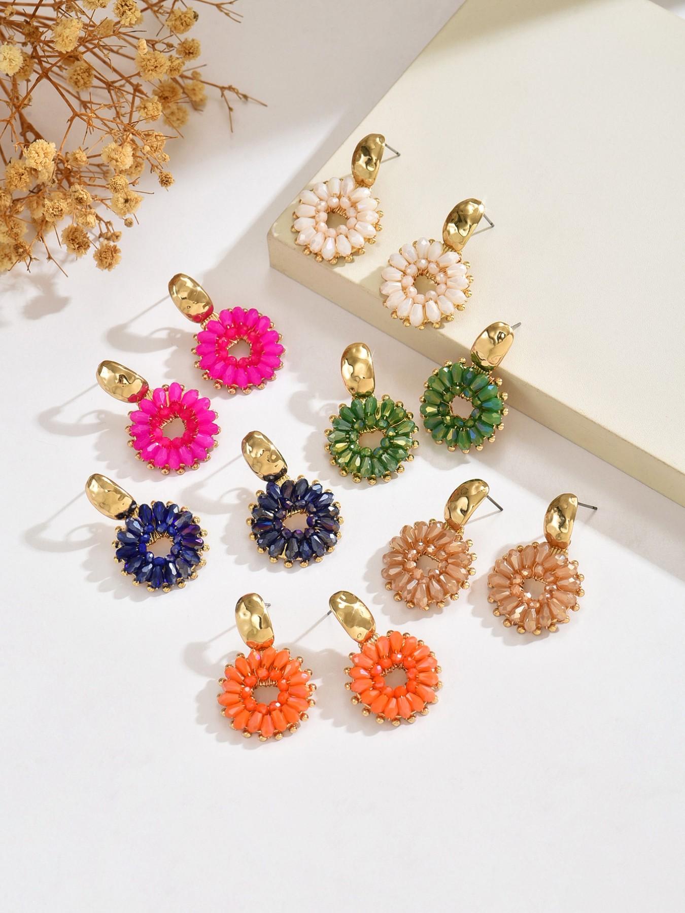 A pair of handcrafted, beaded dangle earrings featuring a chic Bohemian resort style. These round earrings exude an elegant, refined, and understated aesthetic with a premium feel, available in a variety of colors. for women to wear on any occasio