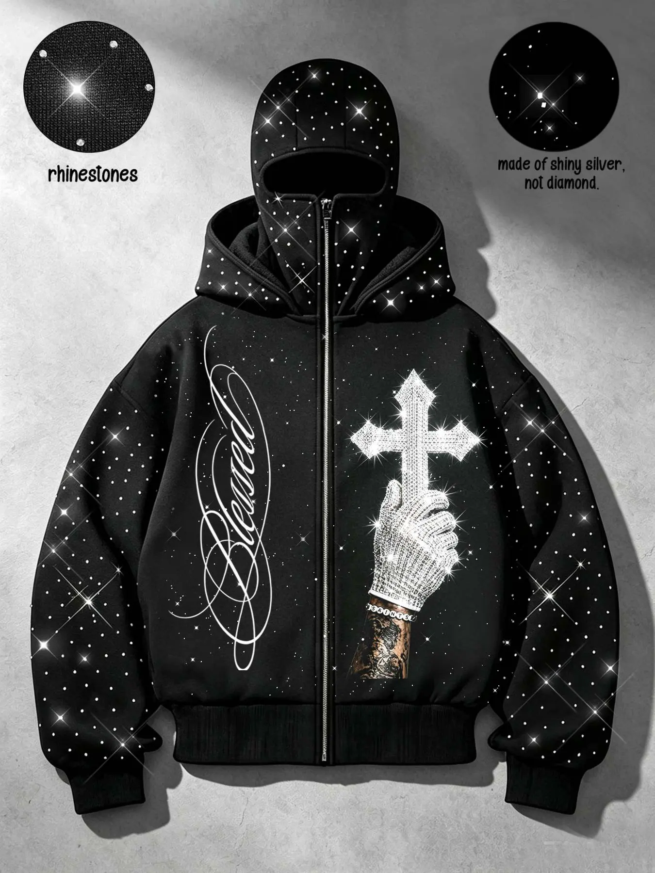 Men's/Unisex American streetwear-style zip-up hoodie featuring "Blessed" script, hand-holding-cross, and ornate mask graphics; embellished with rhinestones on the hood and sleeves; loose, drop-shoulder fit with silver glitter accents on the front and back
