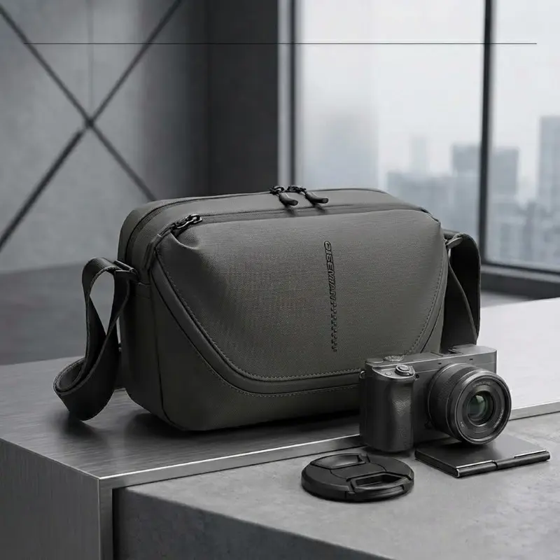 Modern, unisex outdoor photography sling bag; fits one camera body and two lenses; lightweight design with multiple storage pockets; suitable for travel, cycling, and commuting