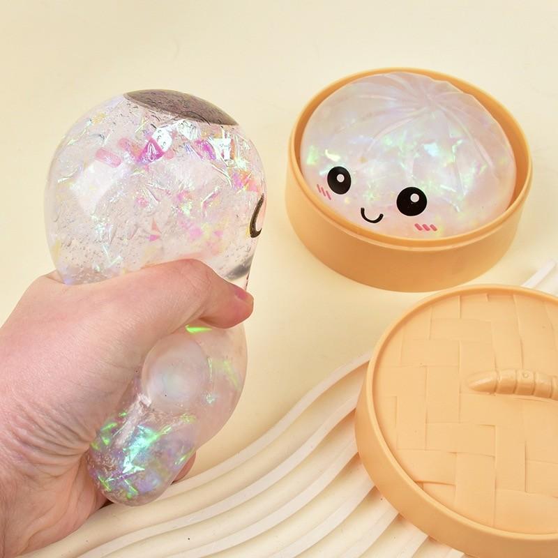 Cute Glitter Dumpling Stress Toy — a smiley-face squeezable sensory toy that’s fun for both kids and adults. Perfect for relaxation and desktop play, it also makes a great gift and a fun icebreaker for socializing and gatherings.