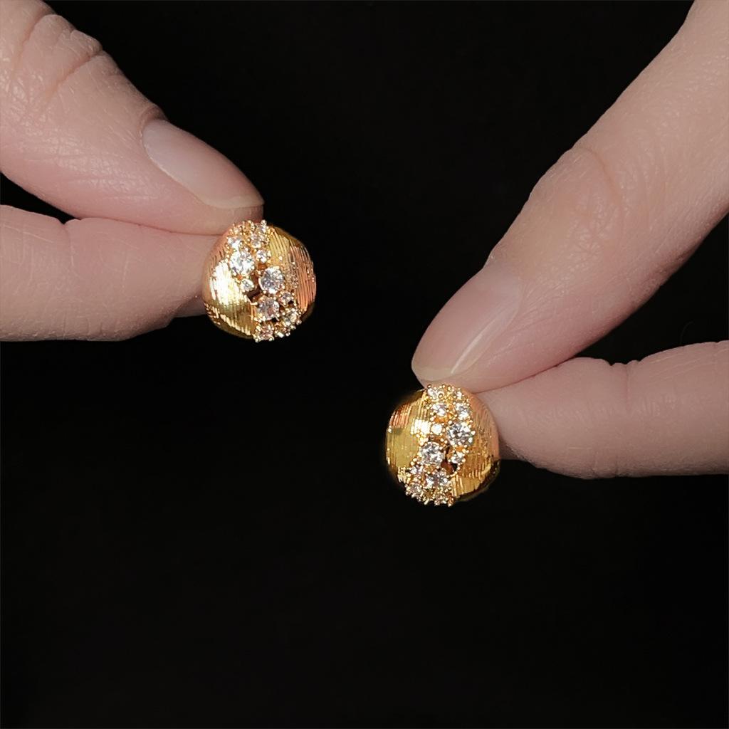A pair of vintage style zirconia brushed round earrings, distinctive, luxurious, and sophisticated studs that are a versatile classic.