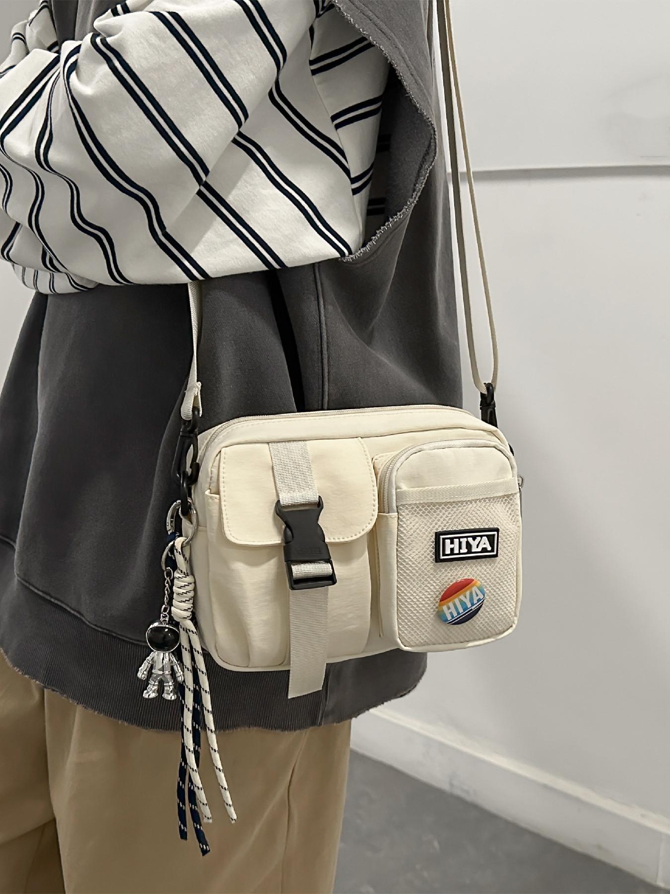 Unisex Casual Plain Color Release Buckle Crossbody Bag with Astronaut Charm, Fashionable Versatile Zipper Crossbody Bag with Random Color Badge, Trendy Shoulder Bag for Daily Use, Casual Messenger Bags, Stylish Crossbody Bags