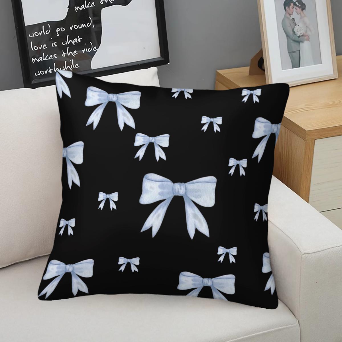 Soft short plush throw pillow with black background and blue bowknot print pattern, featuring a variety of patterns, soft and skin-friendly, a comfortable good for home or travel, embodying a lazy home style