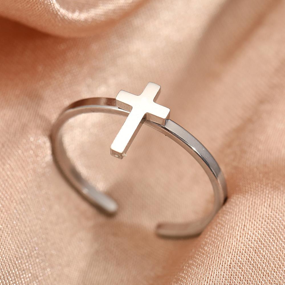 Exclusive and moderately luxurious cross-shaped open ring for couples. A pair of stainless steel jewelry for hands.