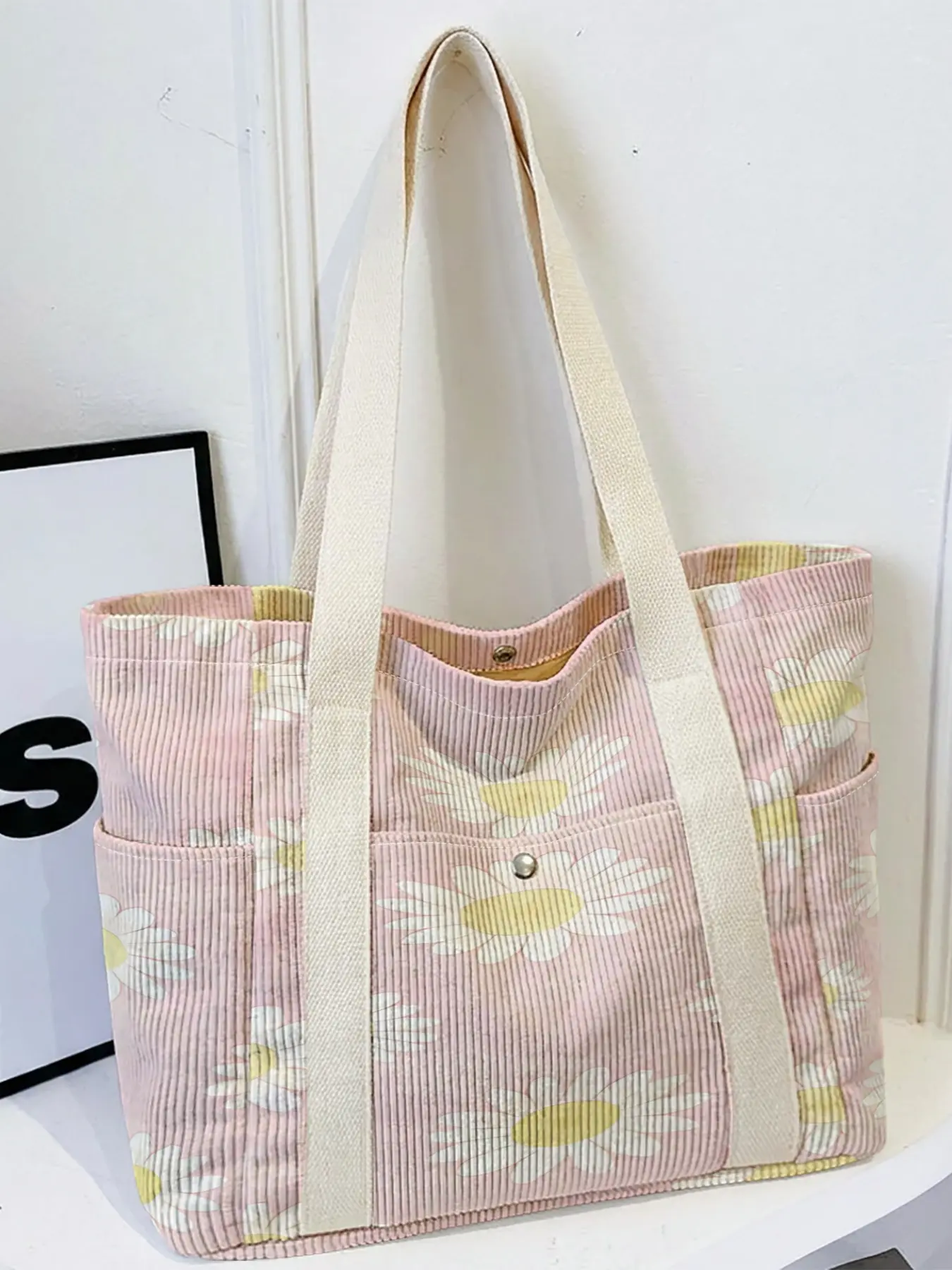 Women's tote bag, 2D Print of White Daisies on Pink Background, Multi-pocket travel tote with wide strap, fit for daily, school and shopping.