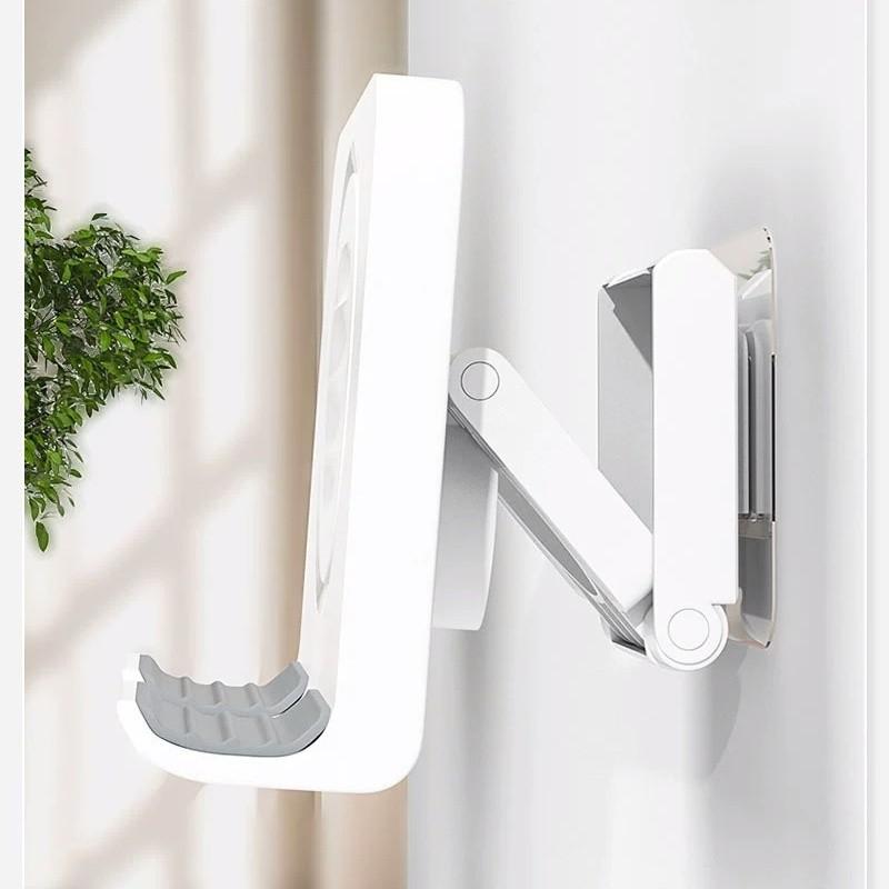 A wall-mounted phone holder, Electronic Mobile Accessory, Cell Phone Holders, featuring punch-free installation and adjustable angle, is a practical gift suitable for installation on walls in bedrooms, living rooms, kitchens, bathrooms, etc