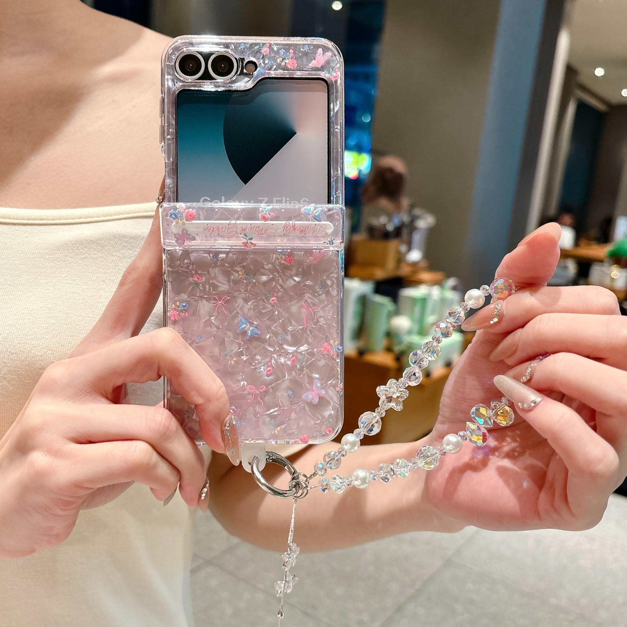 Fresh Floral & Magnetic Snap Shell Pattern Phone Case with optional wrist strap for easy carrying. for Samsung Galaxy Z Flip 5/6/7FE/7. Features a refreshing style, fashionable protection, and unique design perfect for daily use. Protective outer shell.