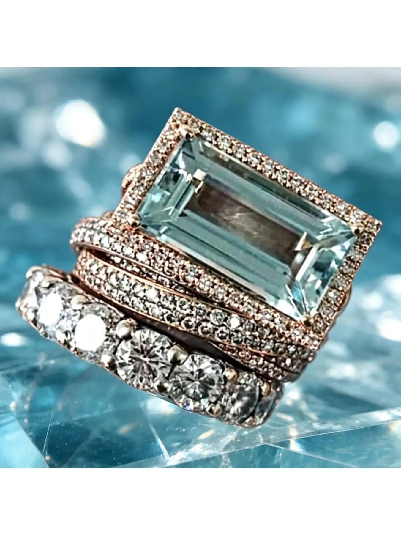 Light blue rectangular main stone set with three layers of interlocking ring bands. Retro multi-ring combination ring with mixed colors, Stackable Fashion Rings. Luxurious yet casual accessory for weddings and daily life.