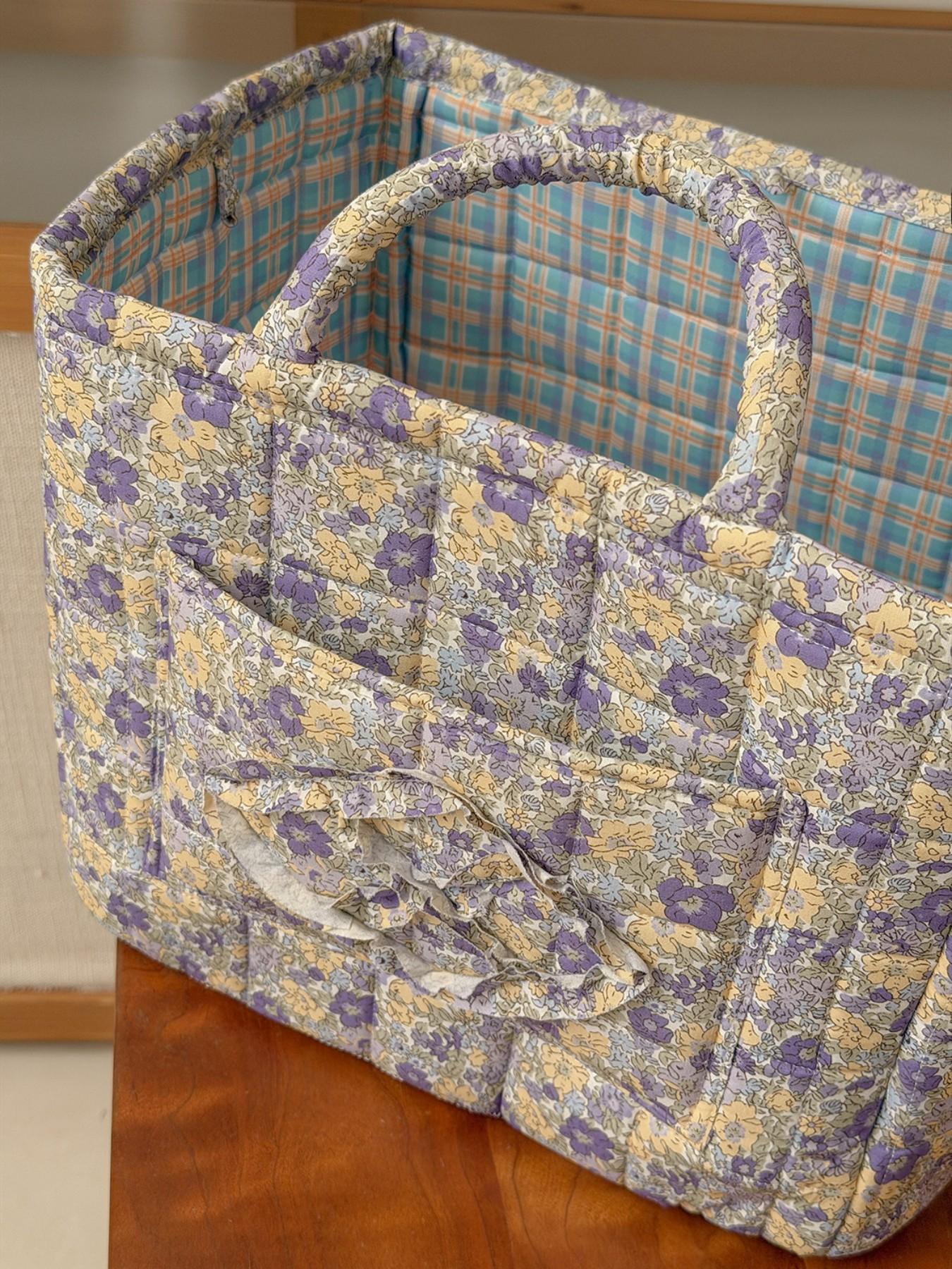 Large capacity floral quilted storage basket with plaid lining and multi-purpose organizer to store makeup, toiletries and daily essentials, perfect for bedrooms, bathrooms, offices and travel
