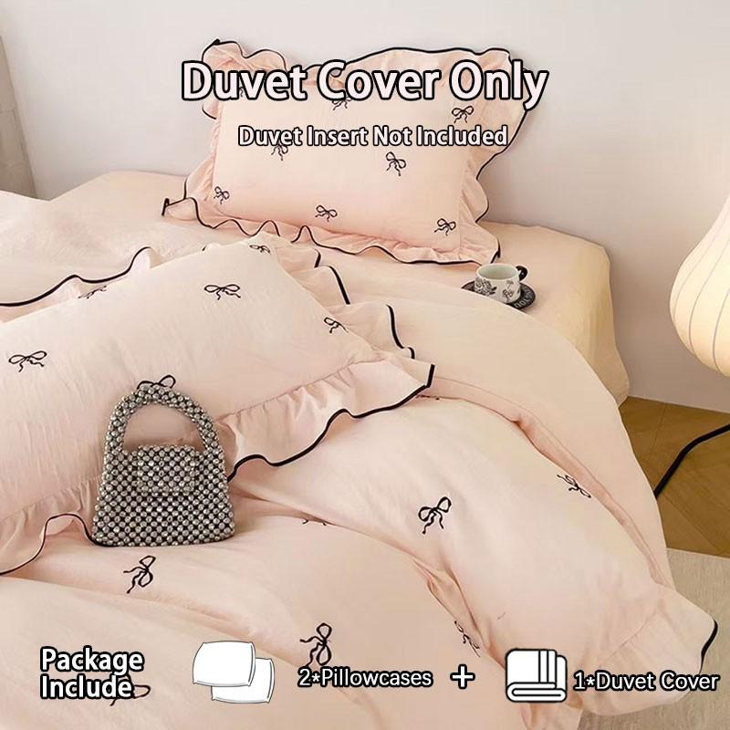 3-Piece Pink Bow Bedding Set with ruffled duvet cover and pillowcases, without fillers, a must-have for exquisite home decor.