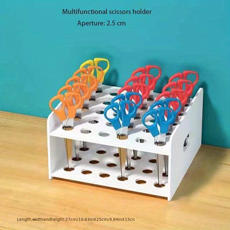 One multi-functional colorful plastic storage box with 35 holes. Neat divided compartments store scissors, brushes and test tubes. Ideal for art, crafts, home and office organization.