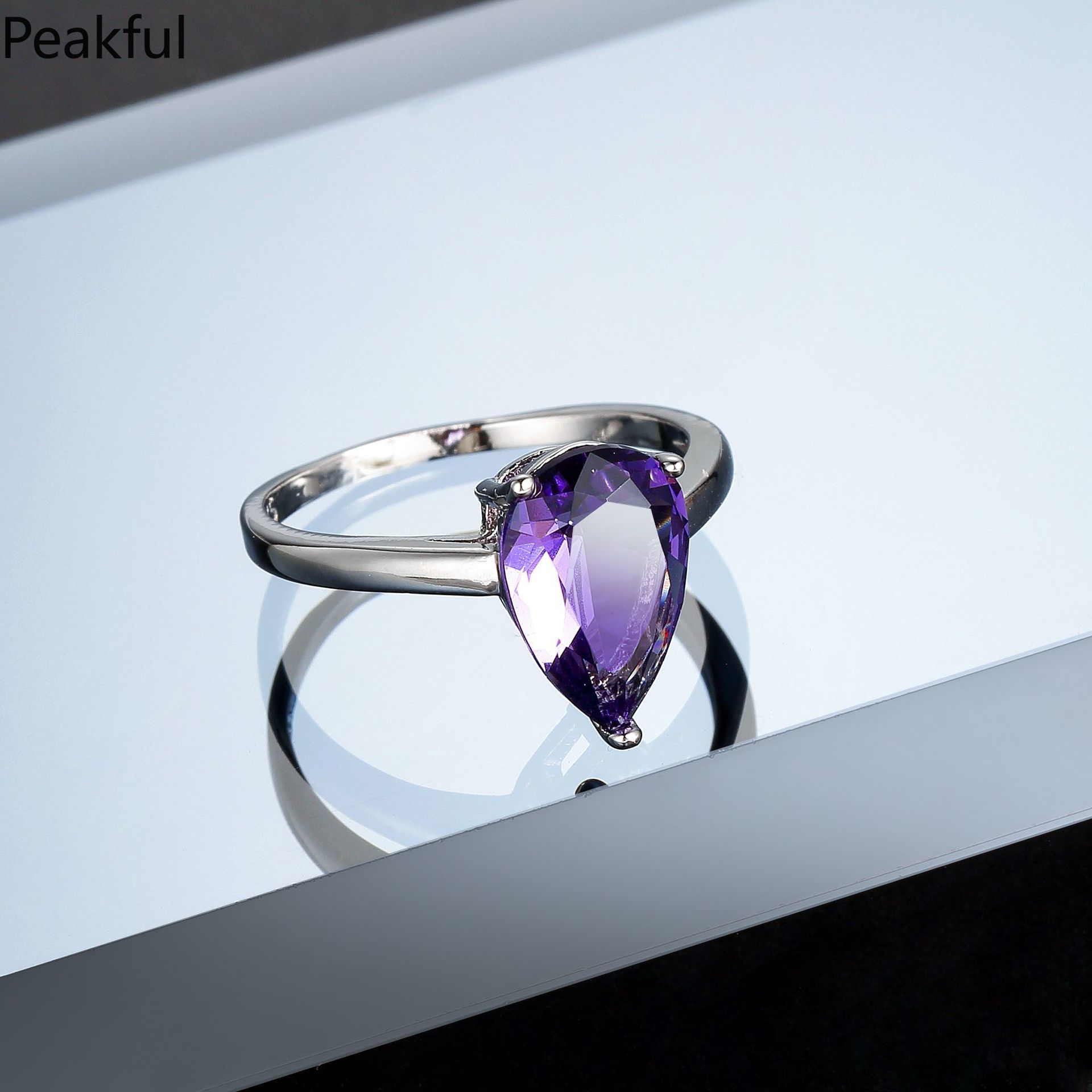 Elegant Amethyst Solitaire Statement Ring, Silver Plated Purple CZ Promise Band for Women, Classic Teardrop & Emerald Cut Designs, comfortable lightweight fit, great for everyday glamour, parties, anniversary gifts and formal styling