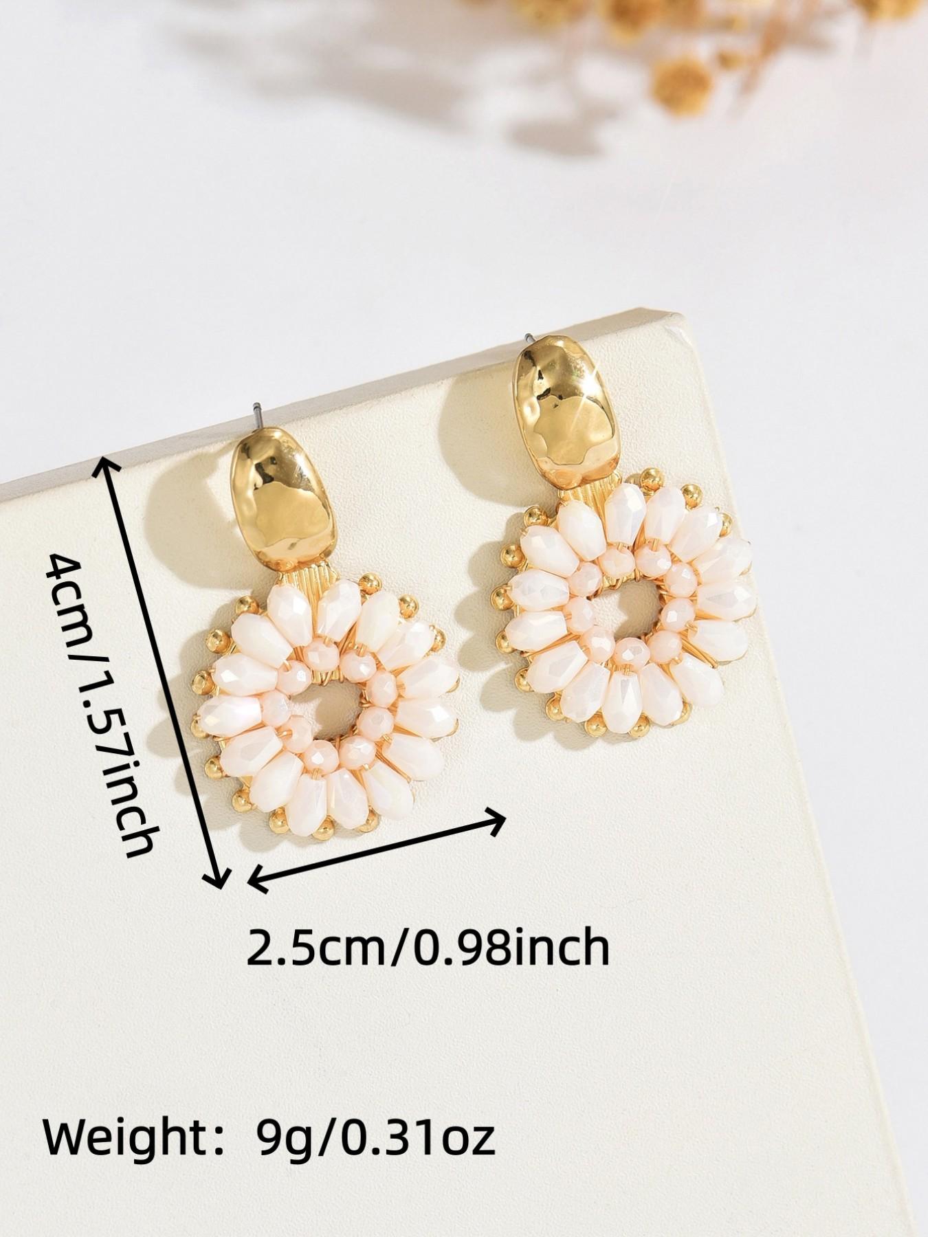 A pair of handcrafted, beaded dangle earrings featuring a chic Bohemian resort style. These round earrings exude an elegant, refined, and understated aesthetic with a premium feel, available in a variety of colors. for women to wear on any occasio