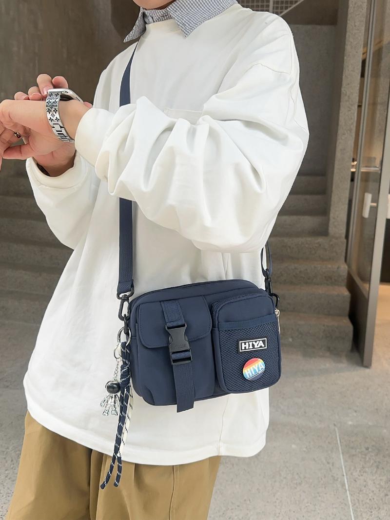 Unisex Casual Plain Color Release Buckle Crossbody Bag with Astronaut Charm, Fashionable Versatile Zipper Crossbody Bag with Random Color Badge, Trendy Shoulder Bag for Daily Use, Adjustable Crossbody Bag