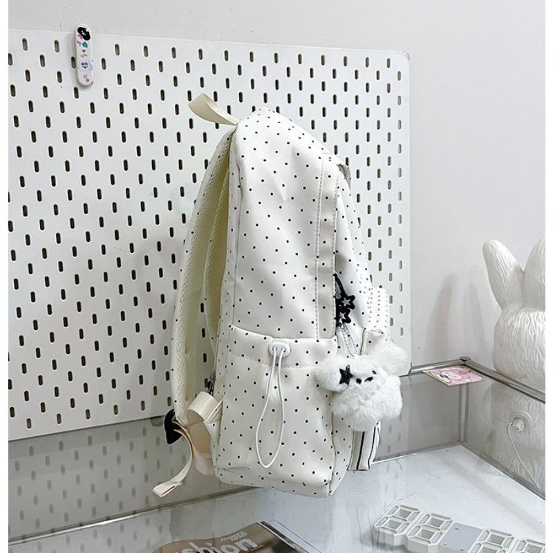 Women's piano-shaped backpack—a cute, polka-dot nylon bag that can be worn as a shoulder bag or backpack. It features an elegant, sweet style with a playful touch, making it perfect for school, commuting, shopping, travel, or as a holiday gift