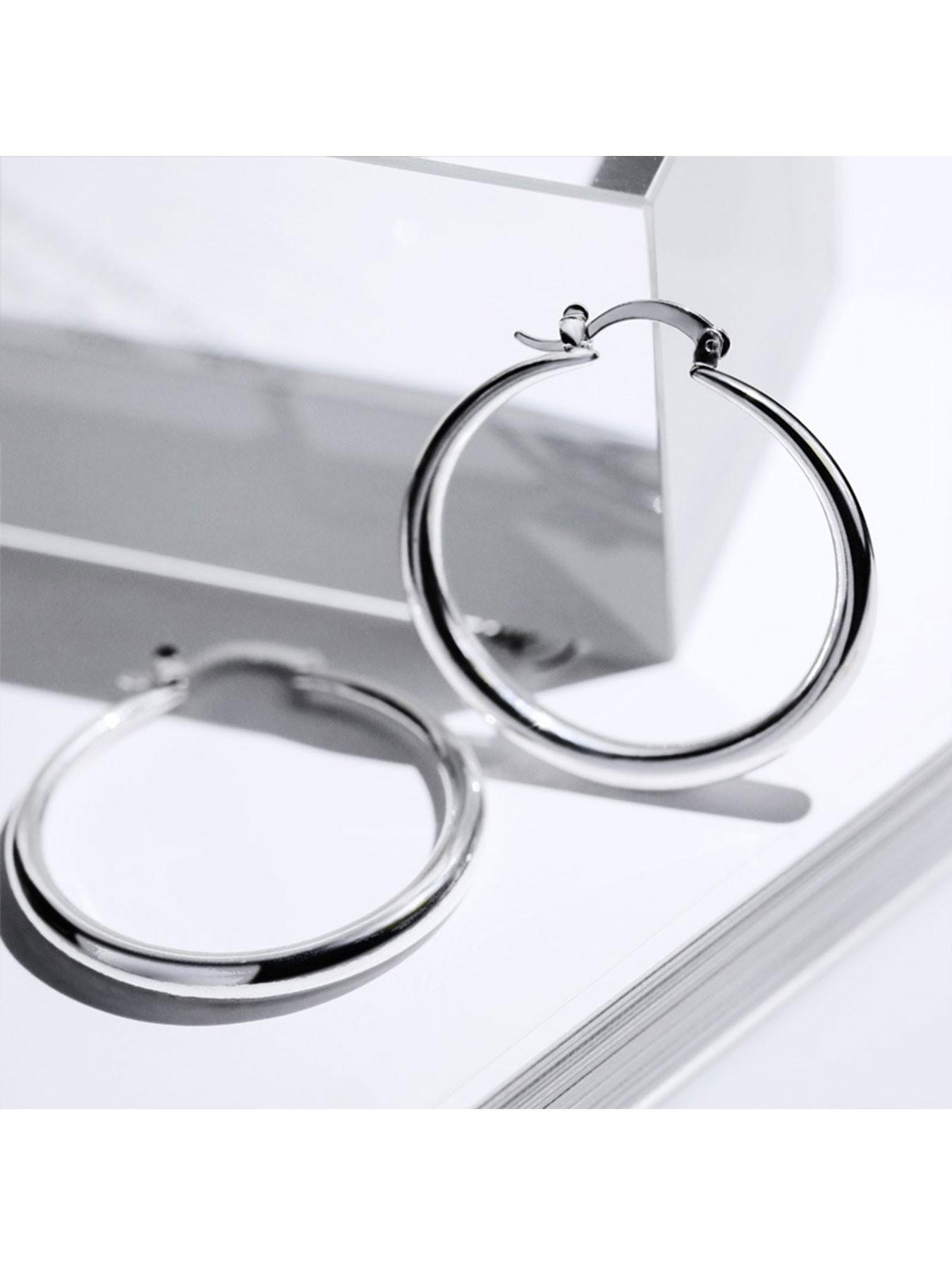 1 pair of gold/silver plated oversized hoop earrings with a minimalist, glossy punk style, perfect for holiday parties and streetwear looks.