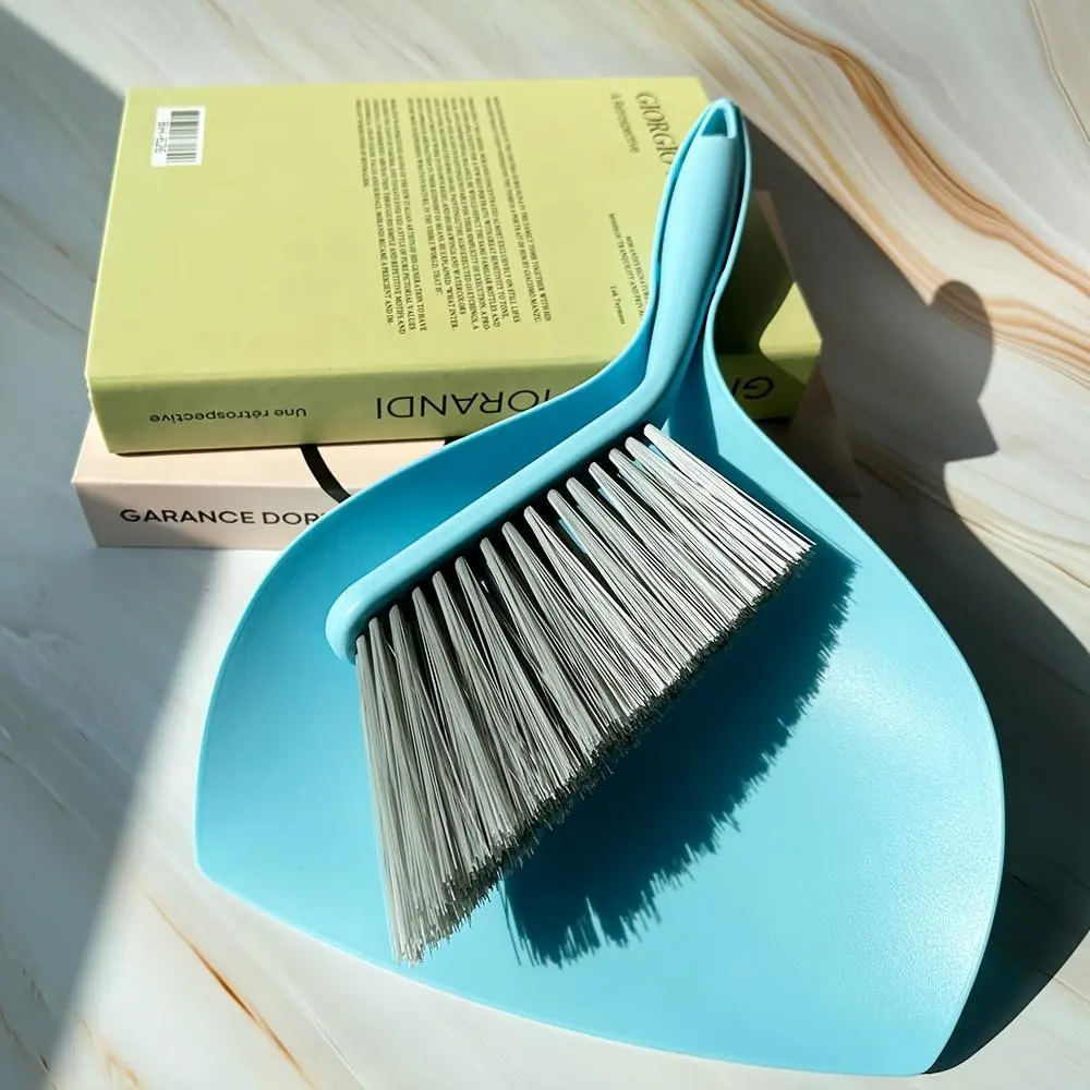 A Dustpan And Brush Set, Consisting of a Small Broom And a Dustpan, Suitable for Cleaning Sofas, Tabletops, Car Seats, Floors, And Tight Spaces. The Broom And Dustpan Are Combined for Easy Storage. The Bristles Have a Moderate Softness