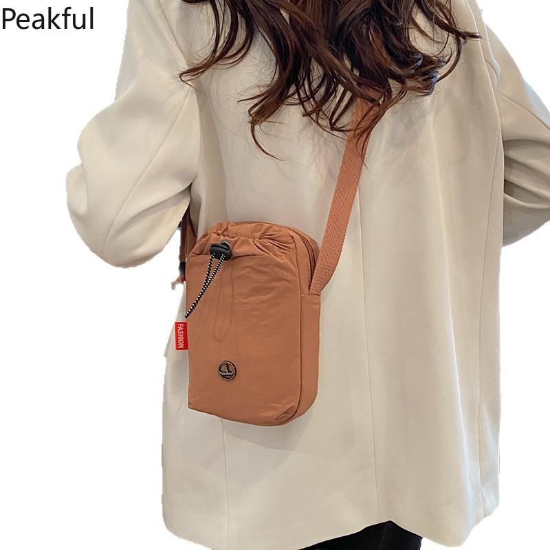 Viral Mini Drawstring Nylon Sling Bag, Fashion Casual Cinch Crossbody Purse, Lightweight Adjustable Strap Shoulder Bag, water-resistant fabric & multi-color options, ideal for travel, gym sessions and everyday hands-free use