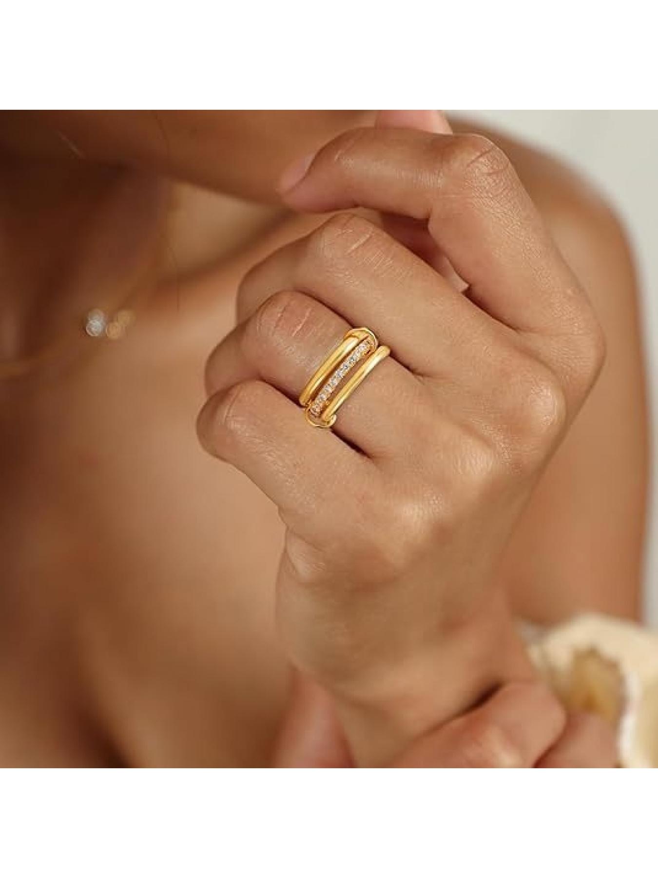 Stainless steel interlocking rings with full diamonds and wave-shaped three-ring design. New color combination and multi-element style.