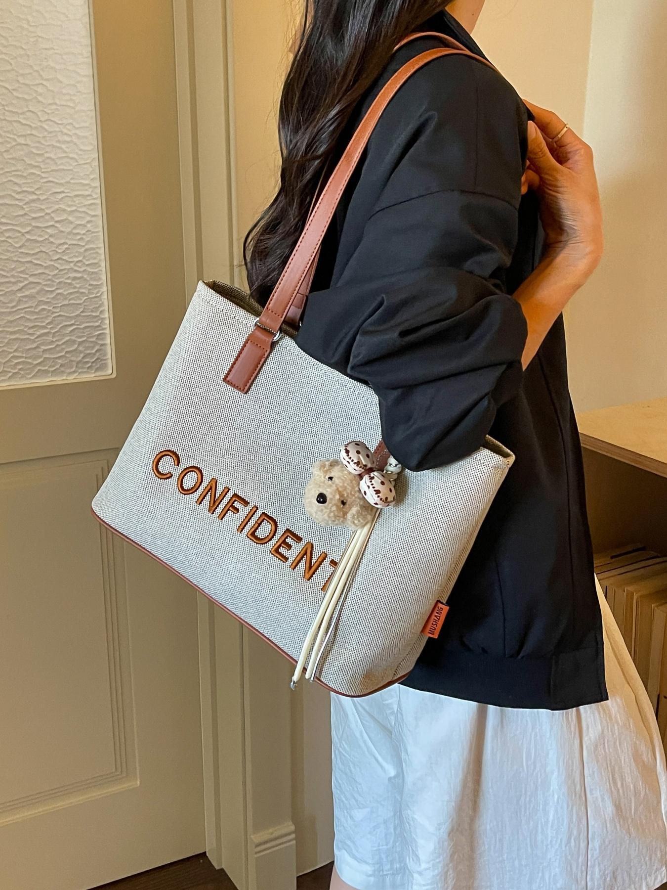 Fashionable and lightweight luxury large-capacity letter-embroidered tote bag, convenient and niche with cute bear pendant for daily commute shoulder/handbag