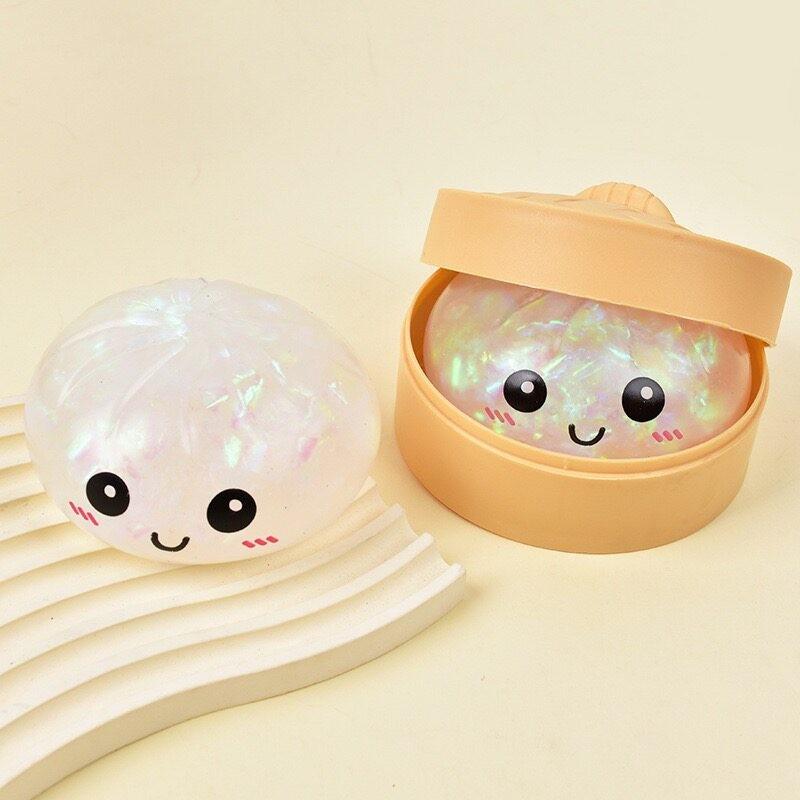 Cute Glitter Dumpling Stress Toy — a smiley-face squeezable sensory toy that’s fun for both kids and adults. Perfect for relaxation and desktop play, it also makes a great gift and a fun icebreaker for socializing and gatherings.
