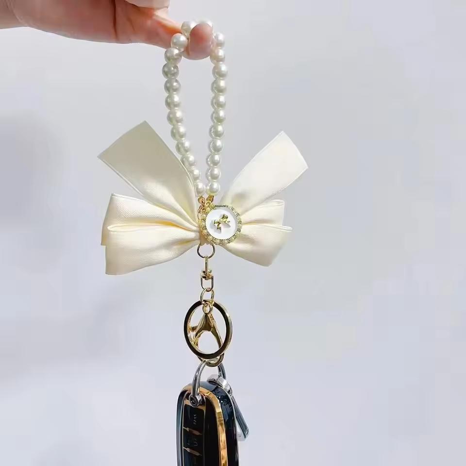Creative Bow, Pearl Chain Keychain, Women's Fashion Bag Pendant, Car Keychain, Phone case chain, Personalized Ribbon Necktie, Fashionable Alloy Keychain