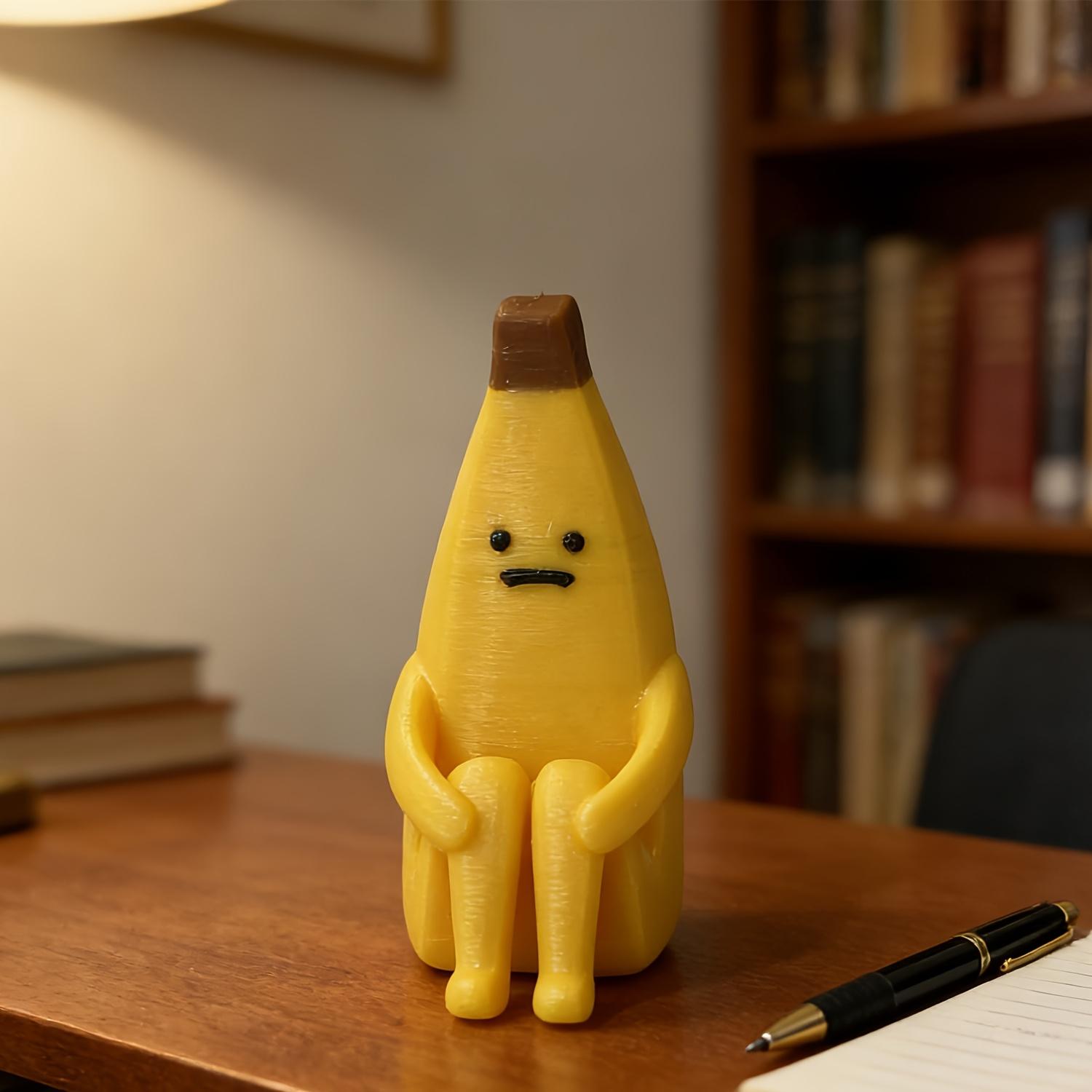 A 3D-printed "Anxious Banana" ornament, crafted from durable plastic—perfect for use as a home tabletop display, office decor, or a unique decorative accent.